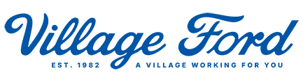 The Village Ford logo, in blue script font, with Est. 1982 and A Village Working For You below.